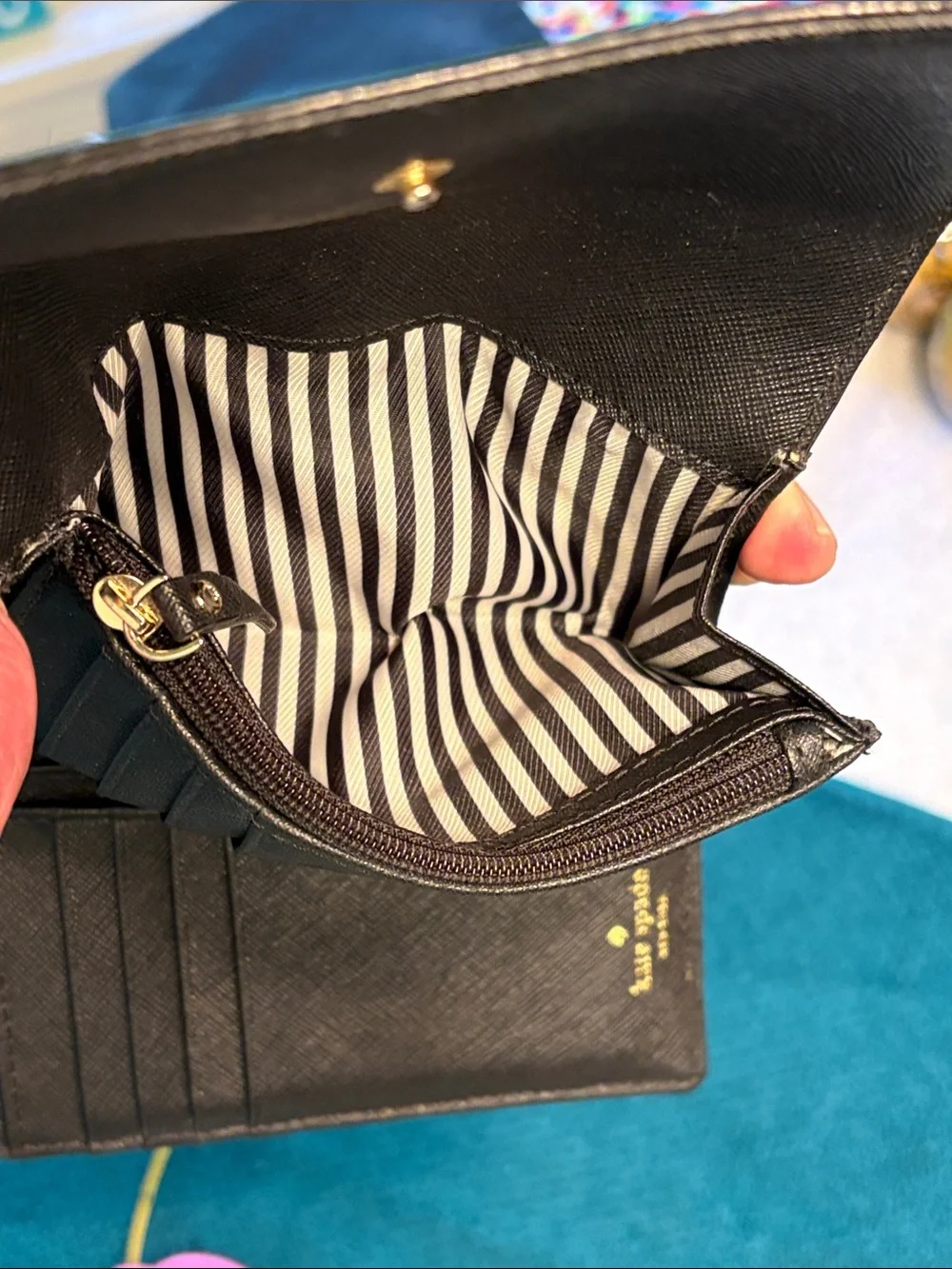 Kate Spade black saffiano tri-fold hand wallet with gold logo